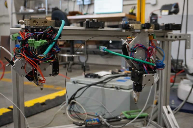 Apparatus to print polymer material onto worn tires.